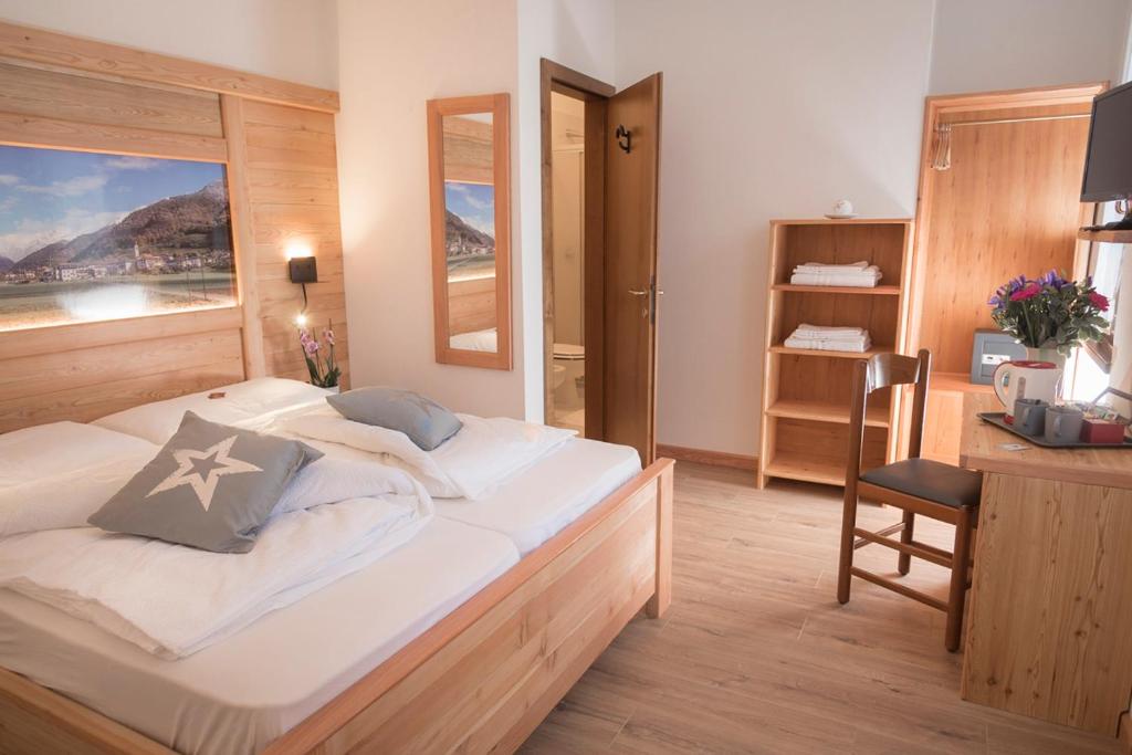 Postel nebo postele na pokoji v ubytování Garni Le Prealpi