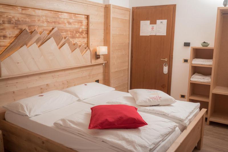 Postel nebo postele na pokoji v ubytování Garni Le Prealpi