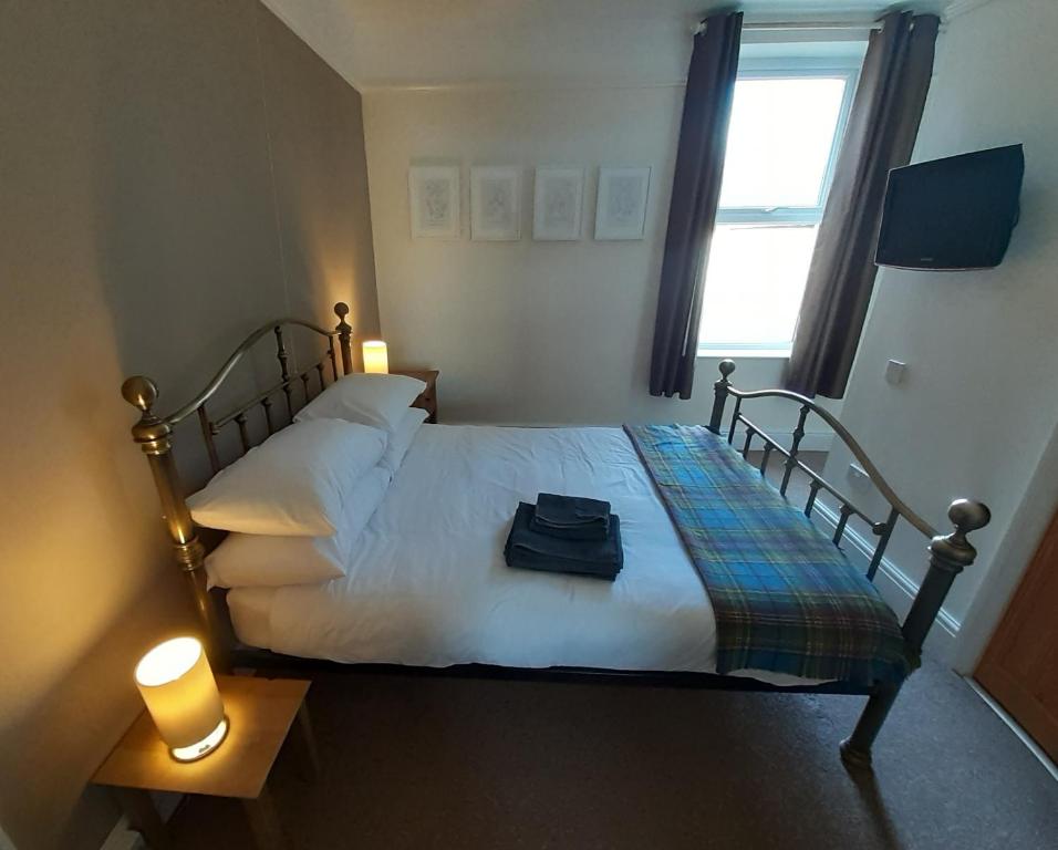 Un pat sau paturi într-o cameră la Vergam Terrace