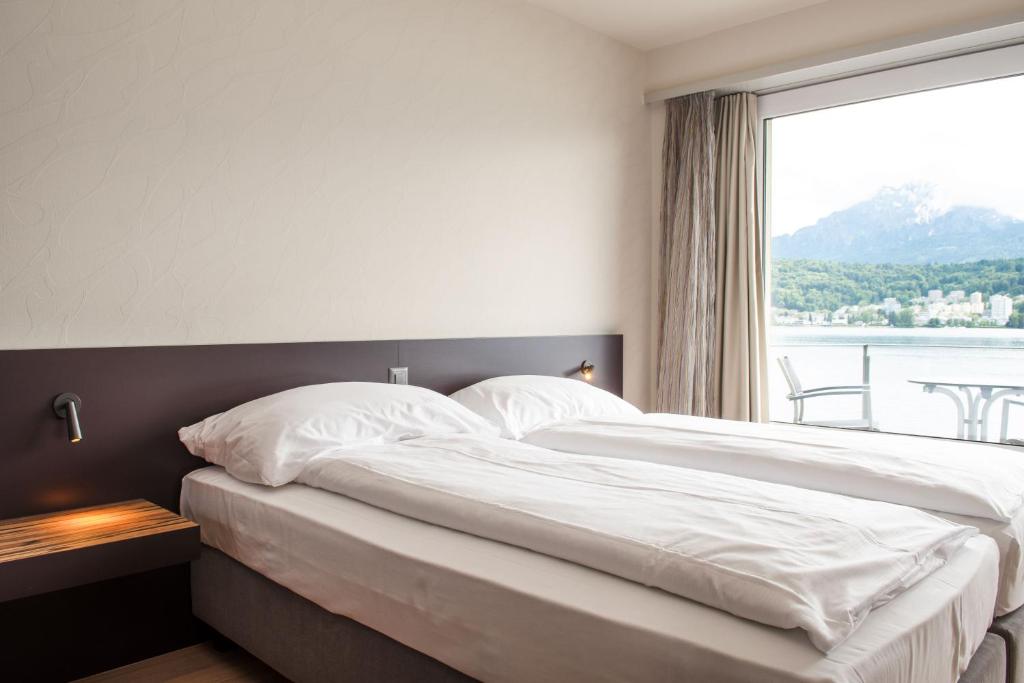 Postel nebo postele na pokoji v ubytování Hotel Seeburg
