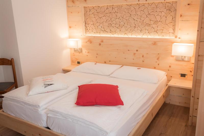 Postel nebo postele na pokoji v ubytování Garni Le Prealpi