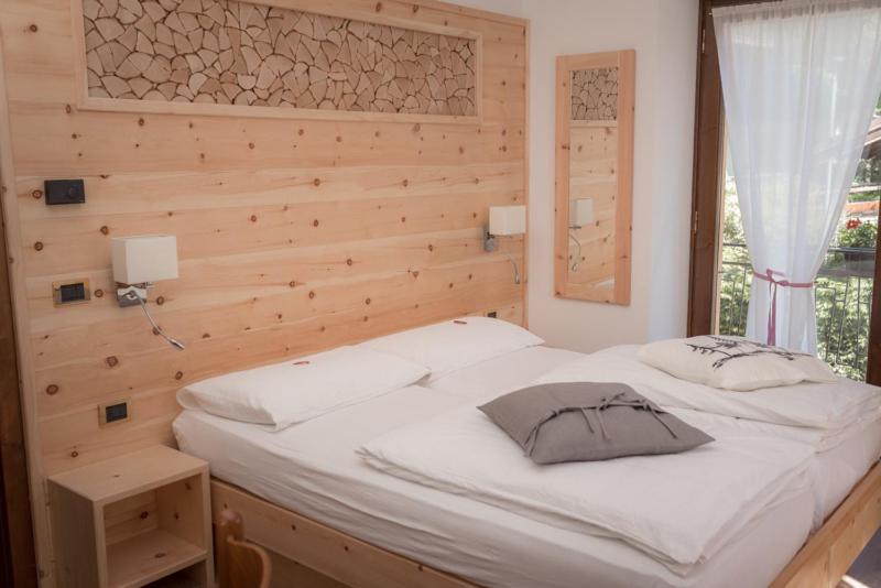 Postel nebo postele na pokoji v ubytování Garni Le Prealpi