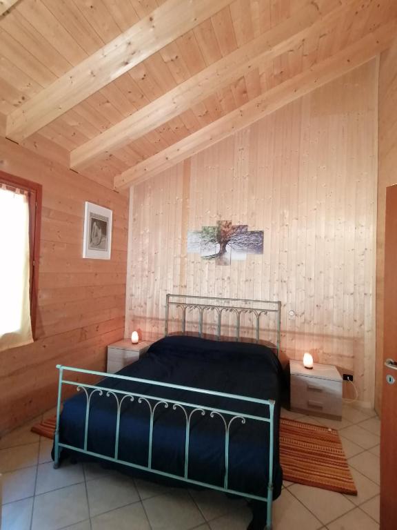 Postel nebo postele na pokoji v ubytování Agriturismo bio Apipoli