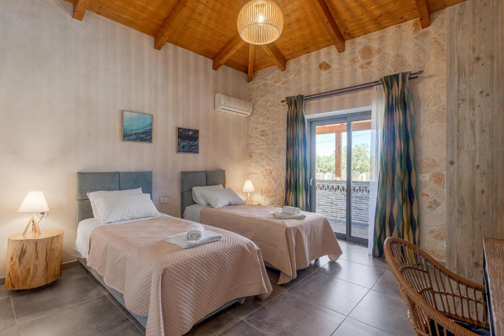 Postel nebo postele na pokoji v ubytování Tierra Olivo Villas