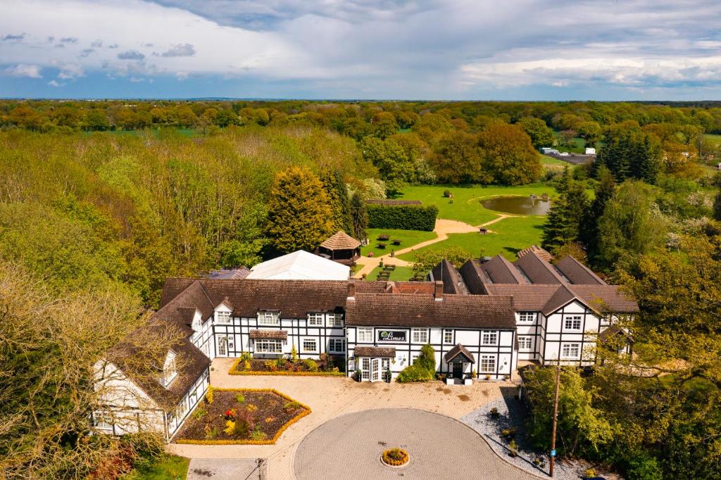an aerial view of a large house with a yard at The Limes Country Lodge Hotel & Admiral Restaurant in Solihull