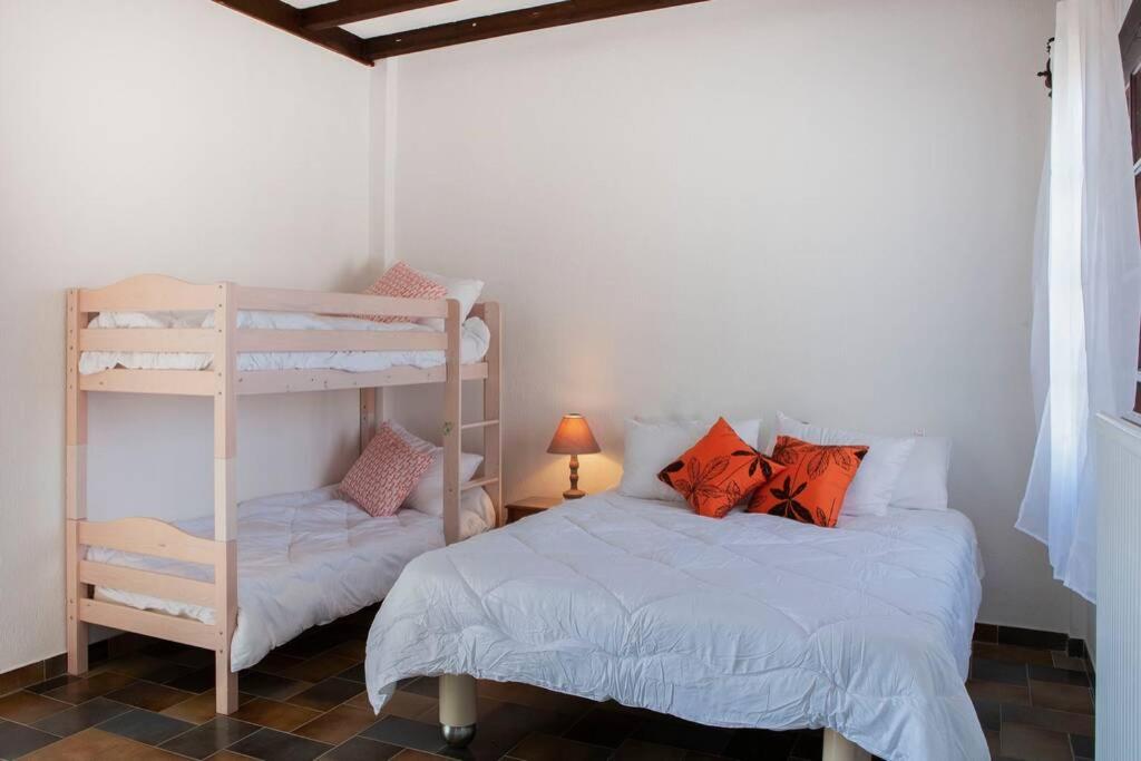 A bed or beds in a room at Villa Velissarios: wonderful villa next to beach