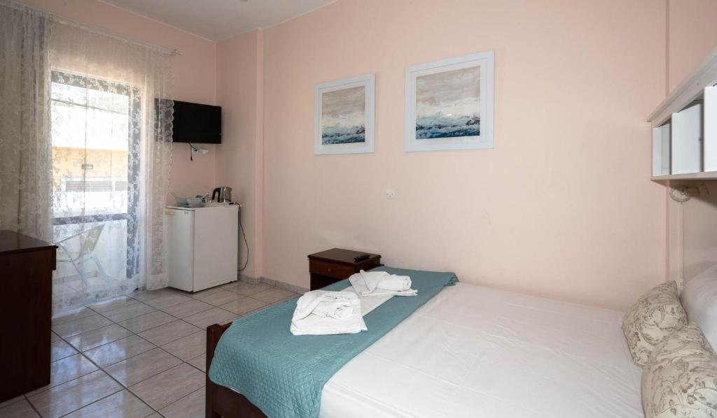 Postel nebo postele na pokoji v ubytování Maria's Hotel
