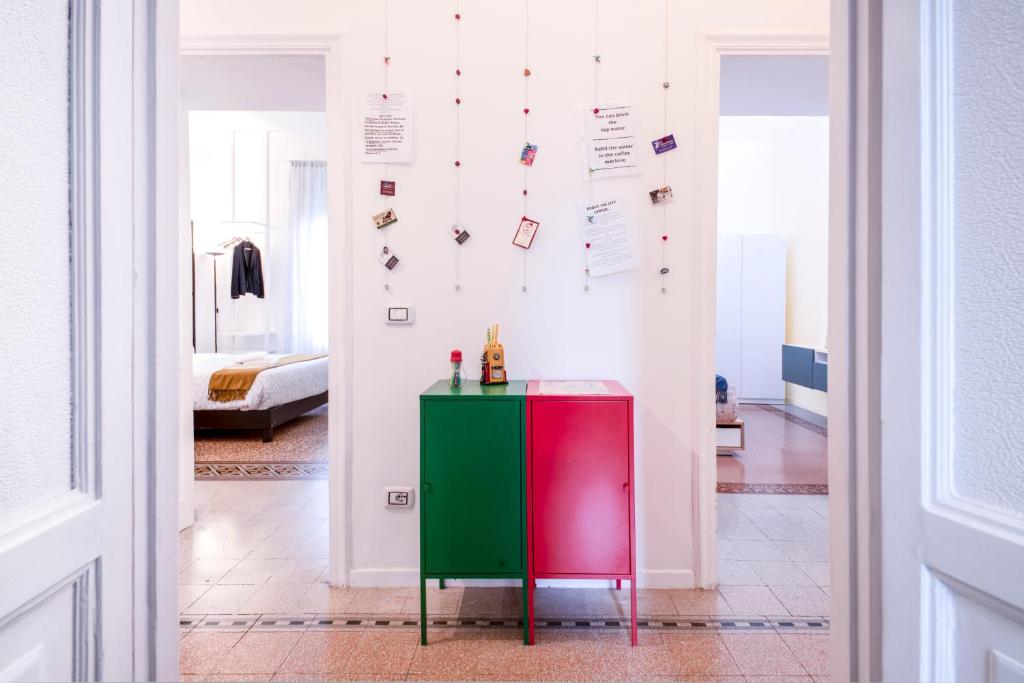a green and red cabinet in a room with a bedroom at Interno 6 San Pietro in Rome