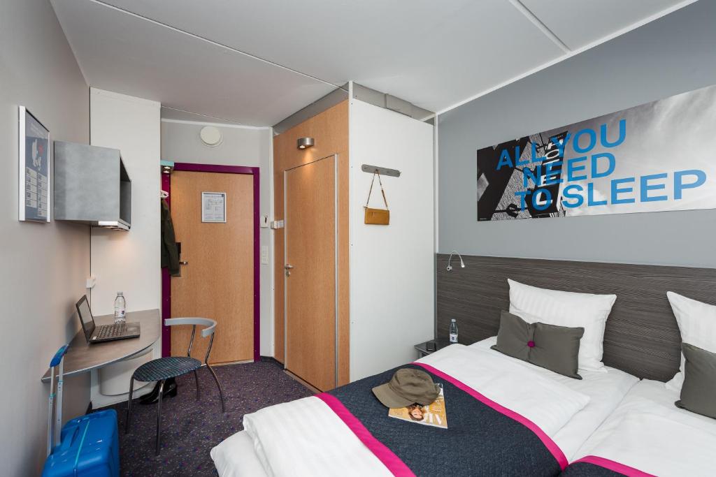 Postel nebo postele na pokoji v ubytování Cabinn Odense