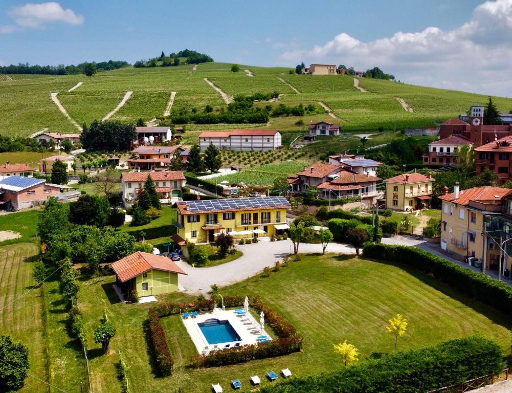 an aerial view of a small village with a house at The Green Guest House in Barolo