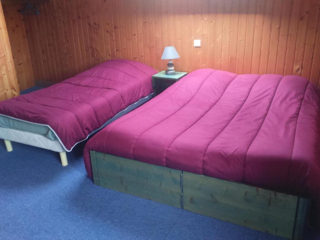 Postel nebo postele na pokoji v ubytování Hotel Les Sapins