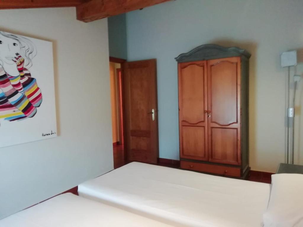 Postel nebo postele na pokoji v ubytování Casa Pedroso