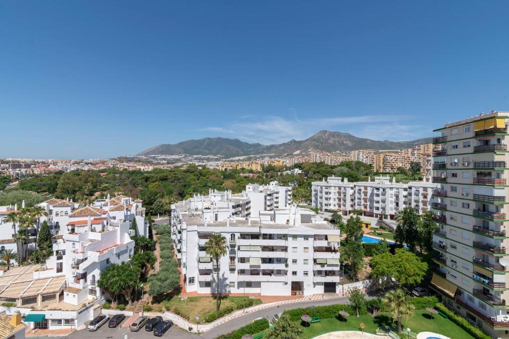 an aerial view of a city with buildings at Panoramic views cosy studio in Benalmádena