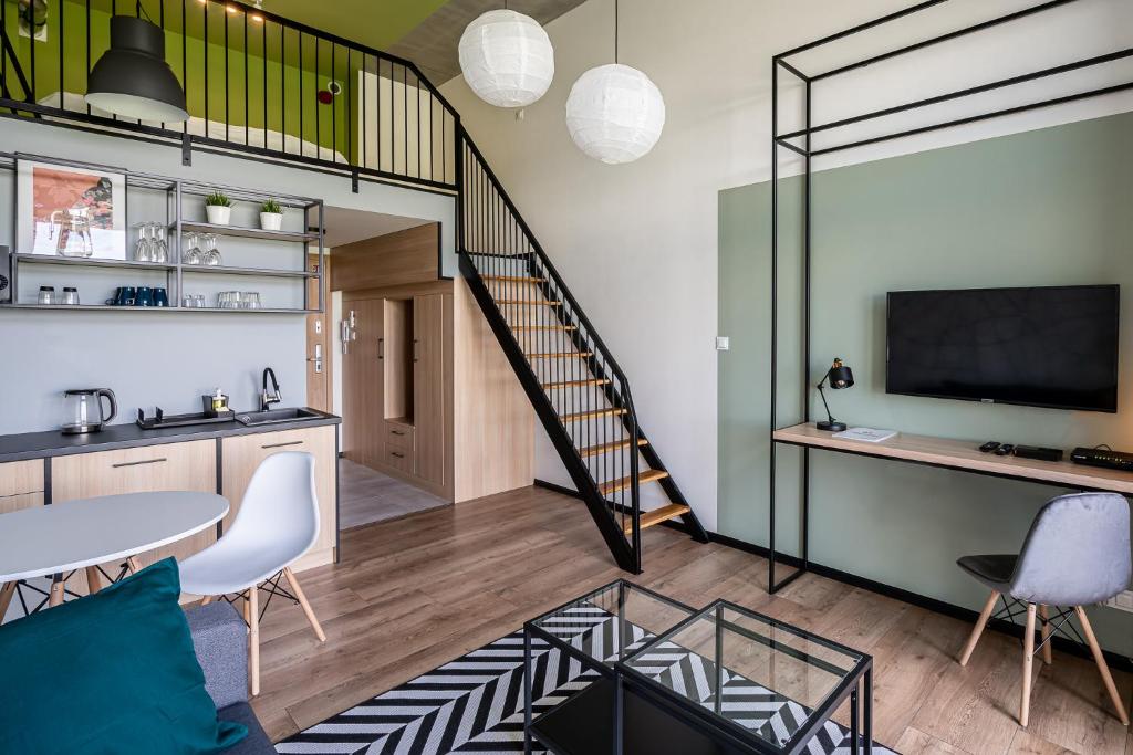 Televízia a/alebo spoločenská miestnosť v ubytovaní RentPlanet - Apartamenty Zarembowicza II
