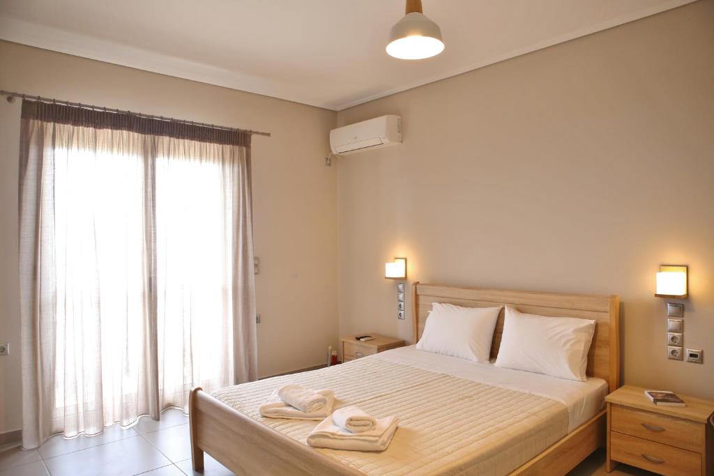 Posteľ alebo postele v izbe v ubytovaní Lefkada Dikran's Guest House