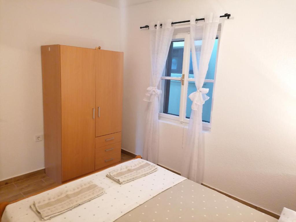 Posteľ alebo postele v izbe v ubytovaní Apartments Amfora