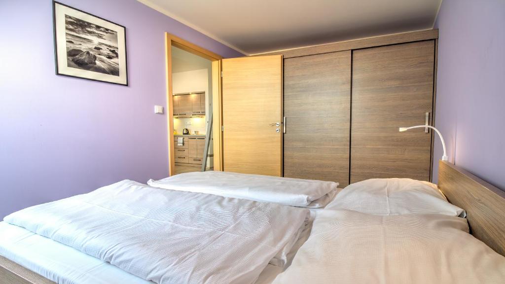 Postel nebo postele na pokoji v ubytování Boromeum Residence