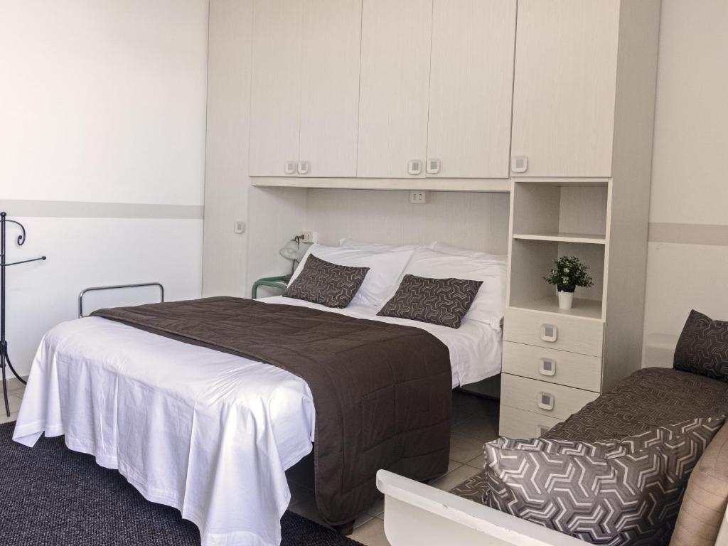 Postel nebo postele na pokoji v ubytování Hotel Funivia