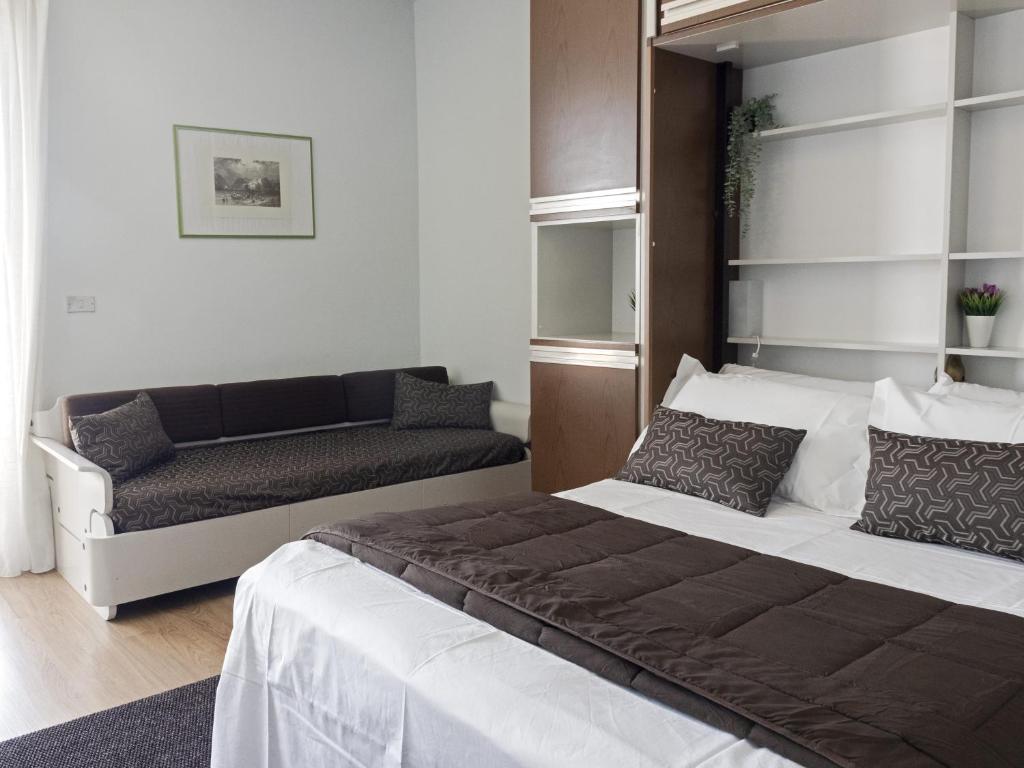Postel nebo postele na pokoji v ubytování Hotel Funivia