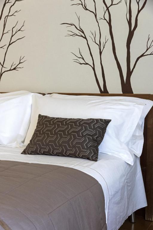 Postel nebo postele na pokoji v ubytování Hotel Funivia