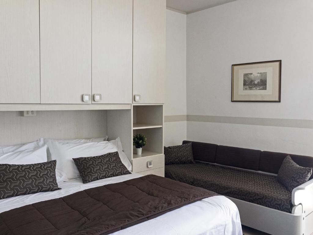 Postel nebo postele na pokoji v ubytování Hotel Funivia