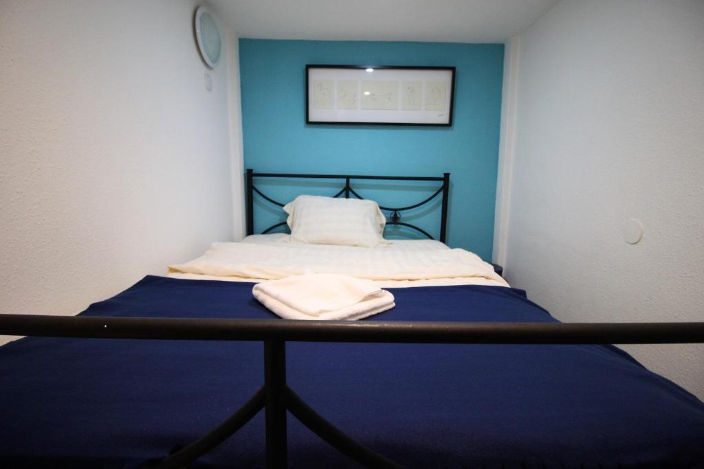 A bed or beds in a room at Budapest Easy Flat Opera