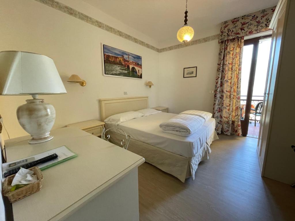Postel nebo postele na pokoji v ubytování Hotel Rabay