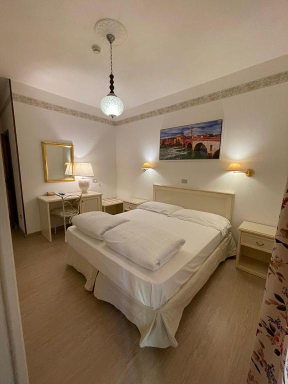 Postel nebo postele na pokoji v ubytování Hotel Rabay