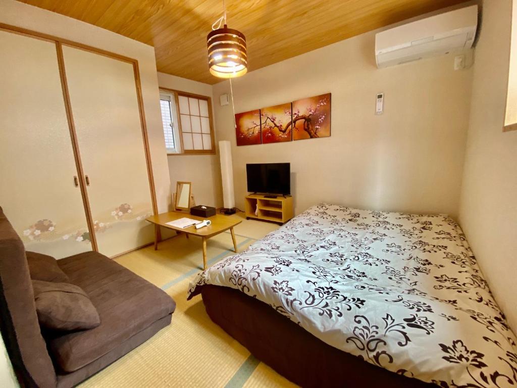 Postel nebo postele na pokoji v ubytování Hotel EL Shinjuku 6