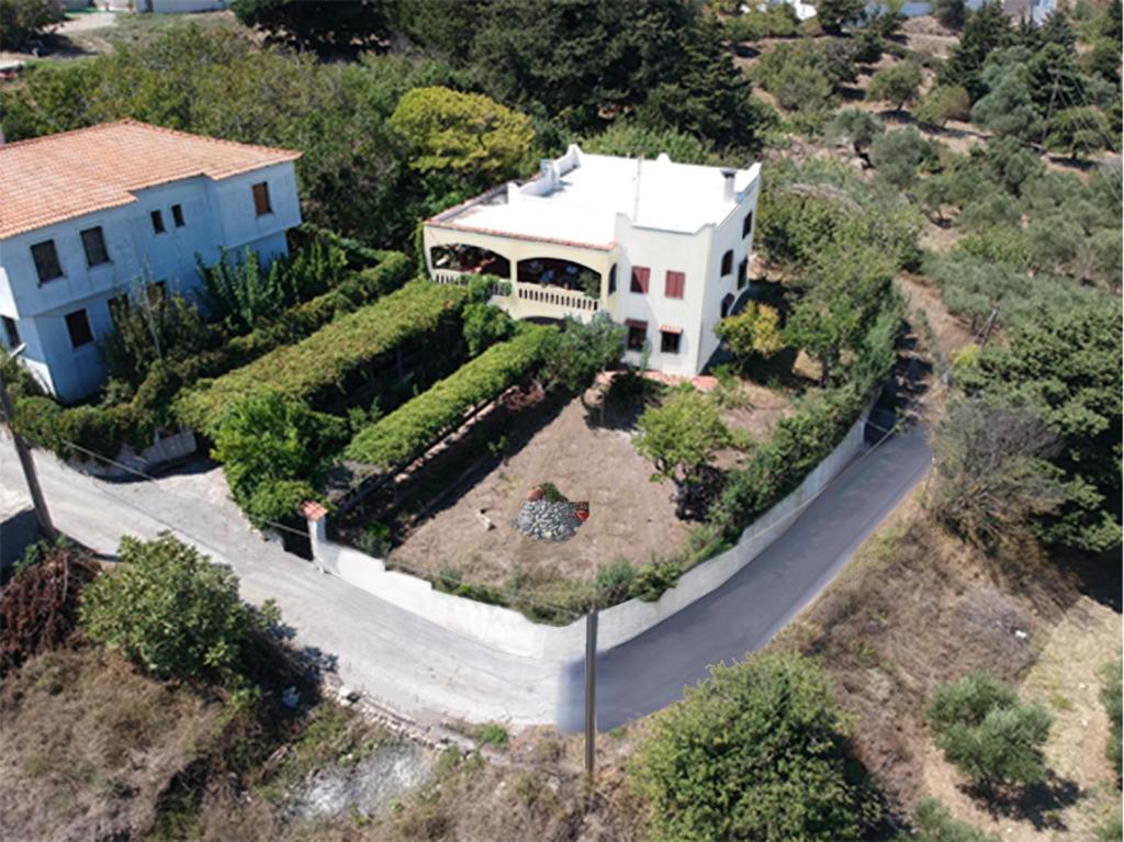 an aerial view of a house with a garden at Hellenick House in Áyios Ioánnis