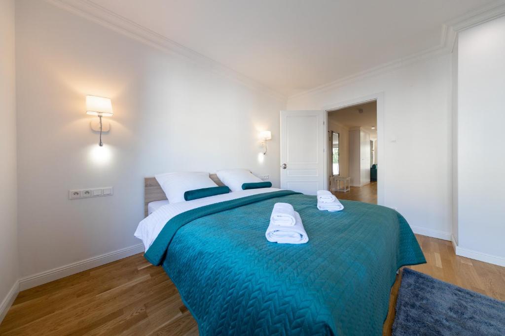 Posteľ alebo postele v izbe v ubytovaní Apartament Nowy Świat Centrum