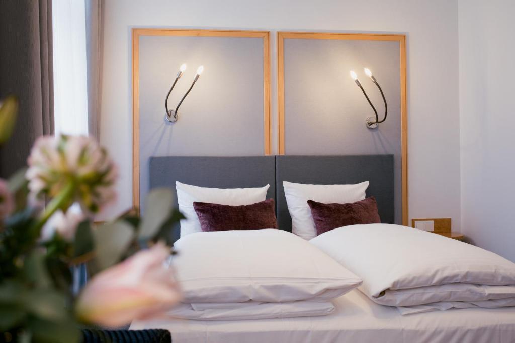 
A bed or beds in a room at DOM Hotel LIMBURG
