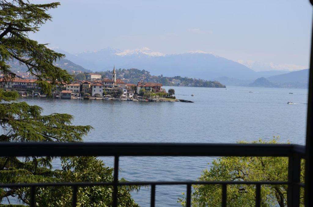 a view of a large body of water with buildings at Hotel Villa Ruscello in Baveno
