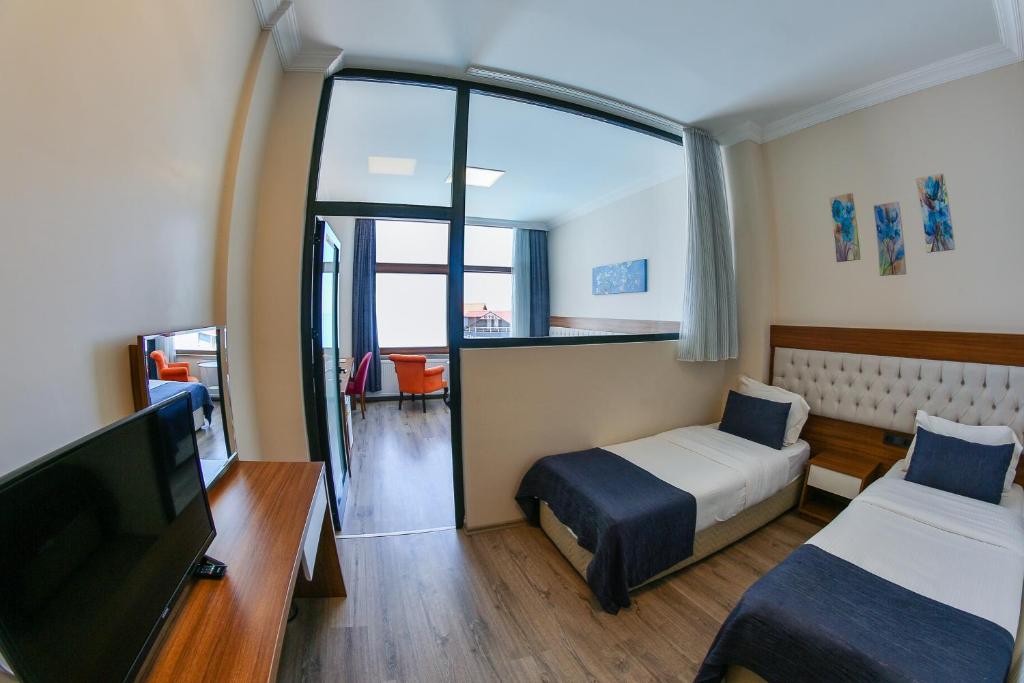 Postel nebo postele na pokoji v ubytování Amasra Diamond Hotel