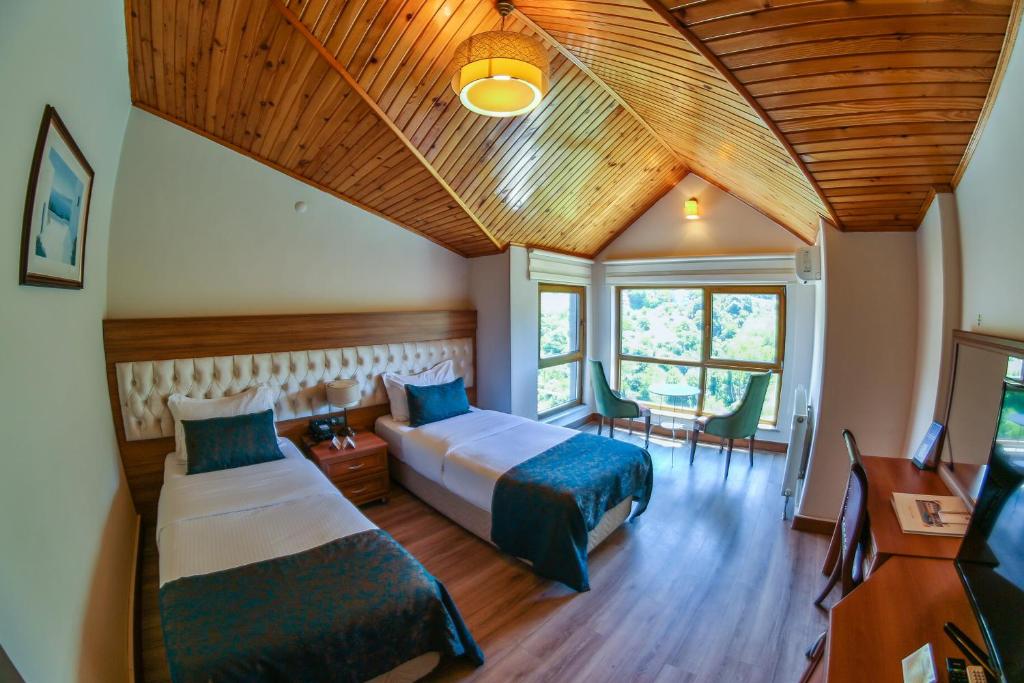 Postel nebo postele na pokoji v ubytování Amasra Diamond Hotel