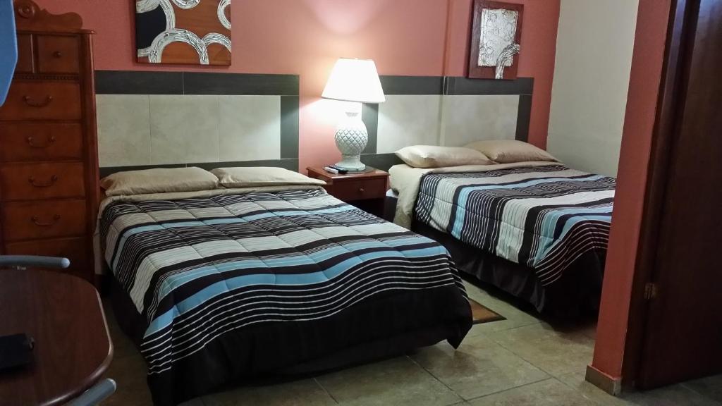 Postel nebo postele na pokoji v ubytování Dreams Hotel Puerto Rico