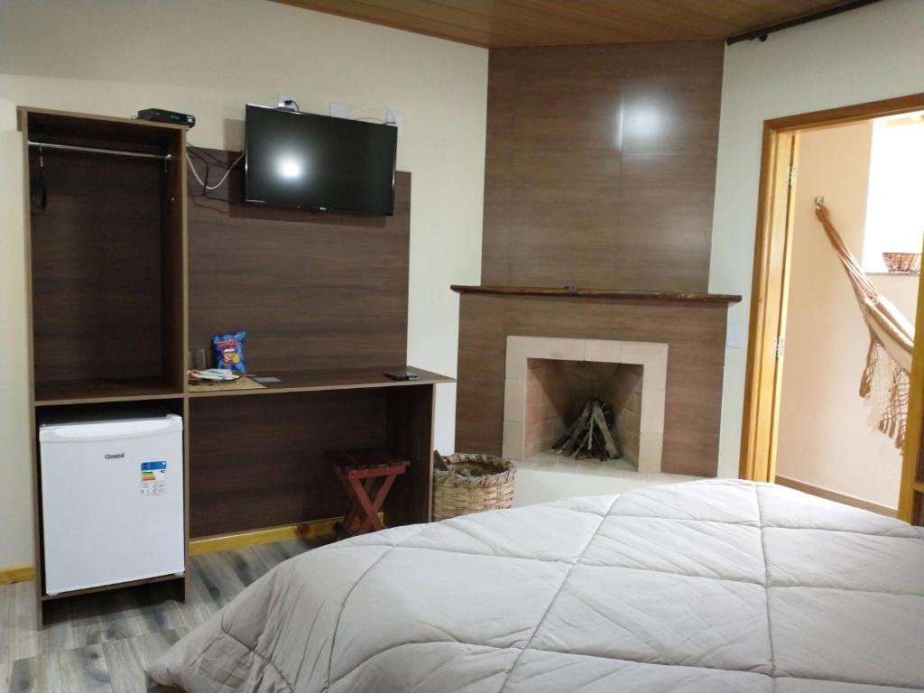 Postel nebo postele na pokoji v ubytování Chalés do Pardal
