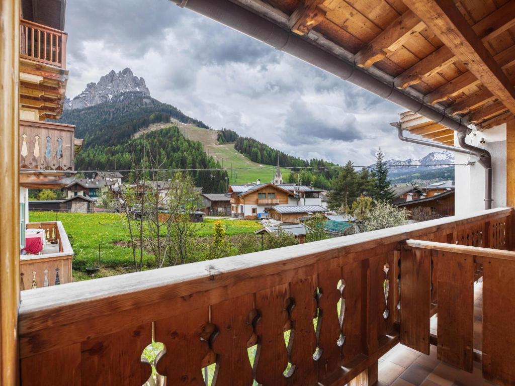 a balcony with a view of a mountain at Ciasa Lino Aloch in Pozza di Fassa