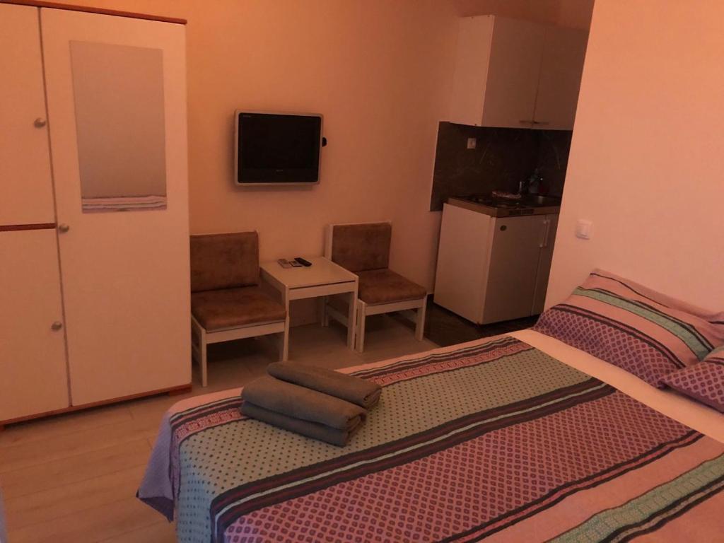 Televízia a/alebo spoločenská miestnosť v ubytovaní Guesthouse Adriatic
