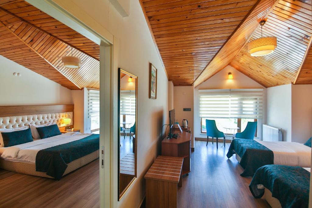 Postel nebo postele na pokoji v ubytování Amasra Diamond Hotel