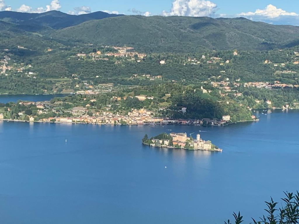 an island in the middle of a large body of water at Casa Isabella in Madonna del Sasso