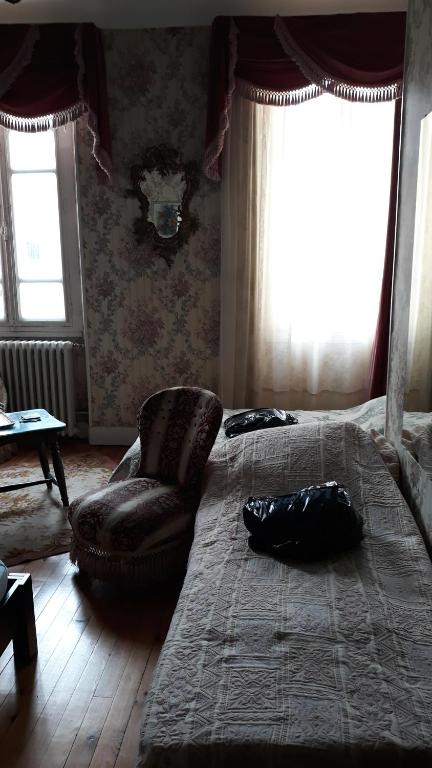 Postel nebo postele na pokoji v ubytování Chez Virginie