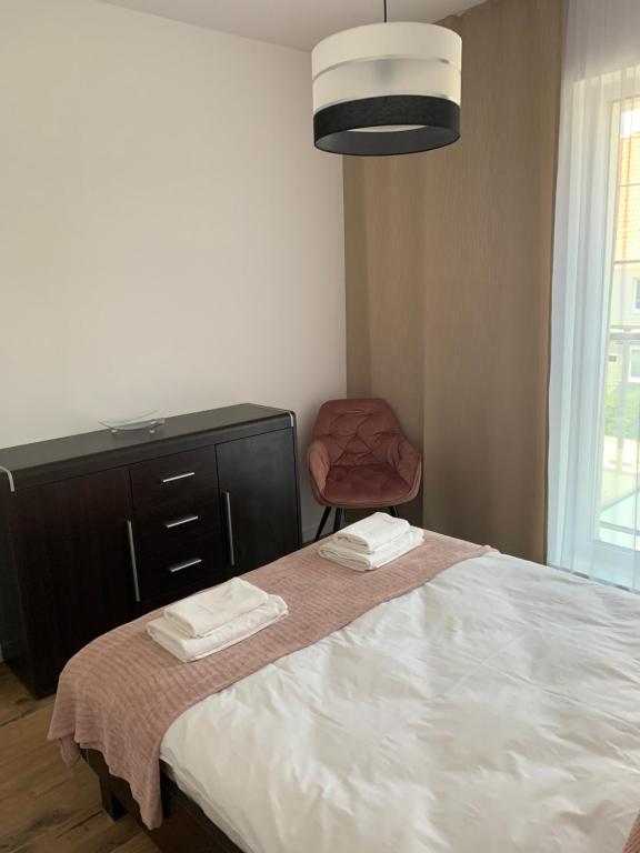 Posteľ alebo postele v izbe v ubytovaní Apartament Joanna