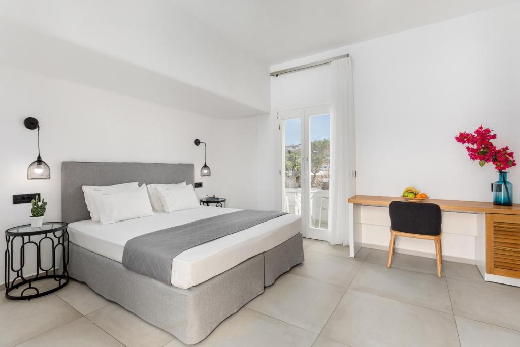 Postel nebo postele na pokoji v ubytování Corfos Hotel