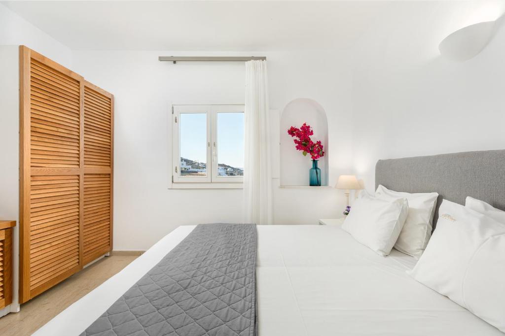 Postel nebo postele na pokoji v ubytování Corfos Hotel