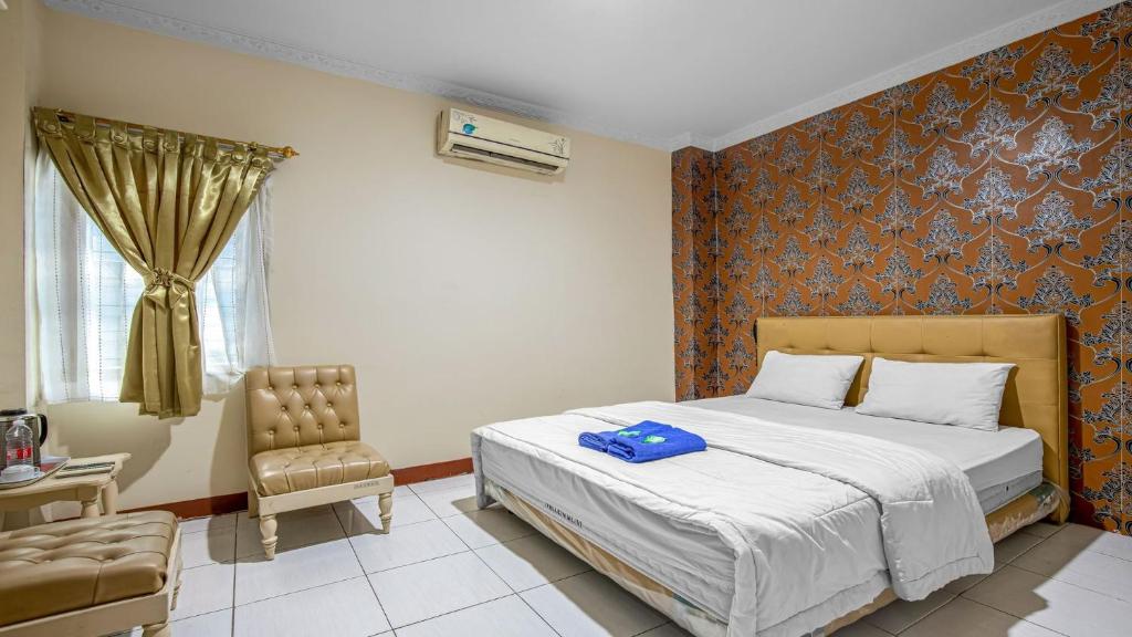 Postel nebo postele na pokoji v ubytování Hotel Cempaka Sari