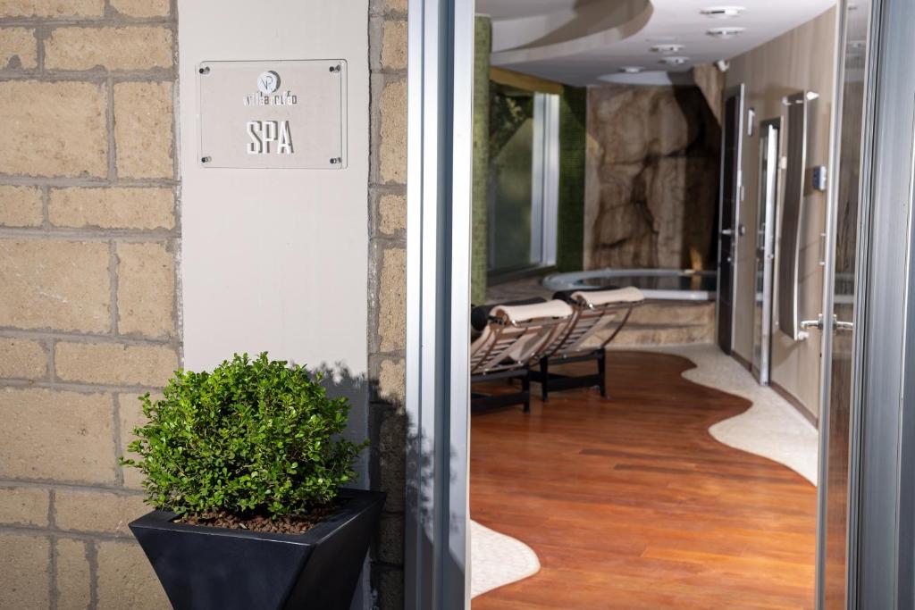 A bed or beds in a room at Villa Rufo