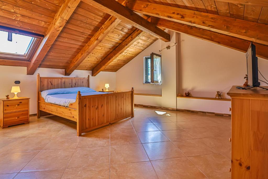 Łóżko lub łóżka w pokoju w obiekcie Casa Vilù