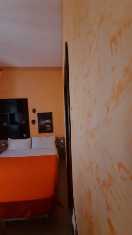 Postel nebo postele na pokoji v ubytování Le Terrazze di Pirandello