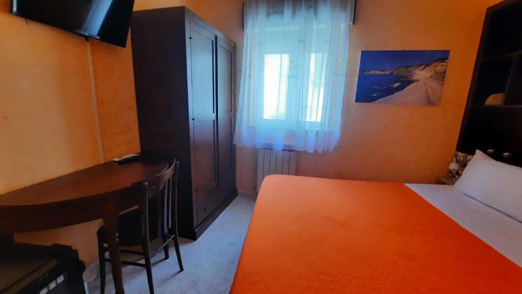Postel nebo postele na pokoji v ubytování Le Terrazze di Pirandello